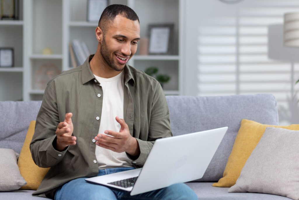 a young african american man is using a laptop si 2025 03 24 20 46 39 utc